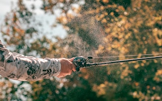 a man is casting a fishing rod