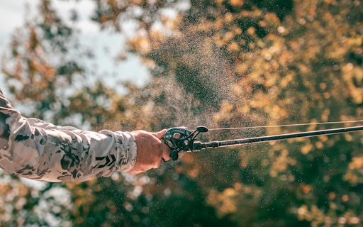 a man is casting a fishing rod