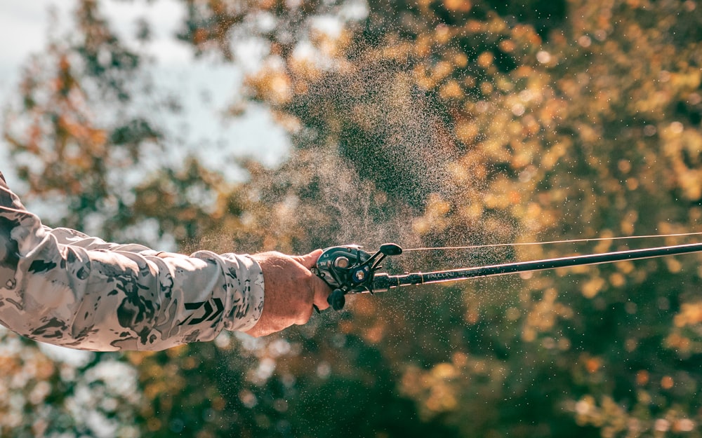 a man is spraying water on his hands