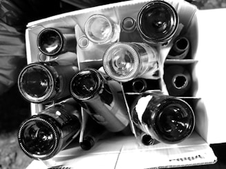 a bunch of wine bottles stacked on top of each other