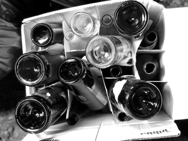 a bunch of wine bottles stacked on top of each other