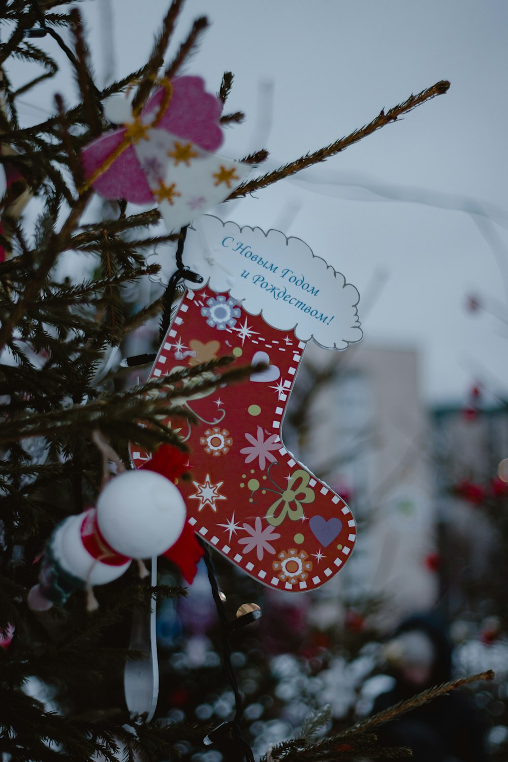 a christmas tree with a stocking hanging from it