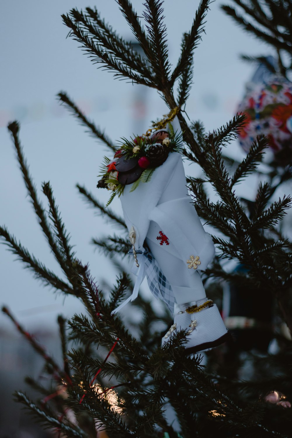 a close up of a christmas tree with a ribbon on it