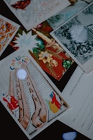 Stack of assorted Sang LLC Christmas cards showcasing various 3D snowflake patterns.