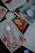 A collection of festive greeting cards, featuring colorful holiday designs and motifs. Some cards have Russian text, and one card prominently displays an illustration of Santa Claus next to an escalator. The images include decorations like ornaments and pine branches.
