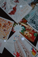 A collection of festive greeting cards with Russian text. The cards feature winter and holiday-themed imagery such as red berries, decorated trees, architectural elements, and holiday ornaments. Some cards show illustrations of a Santa Claus figure.