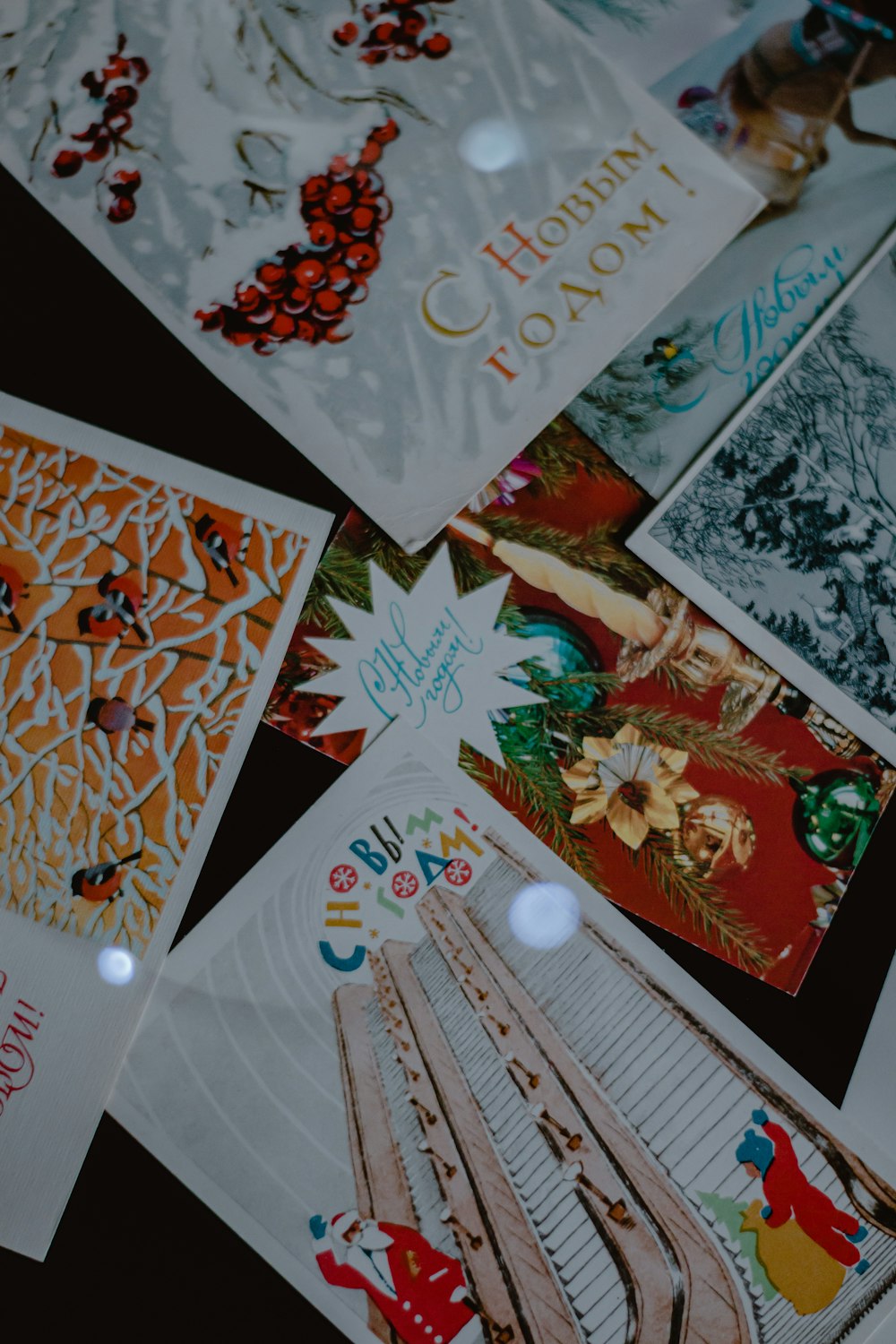 a pile of christmas cards sitting on top of a table