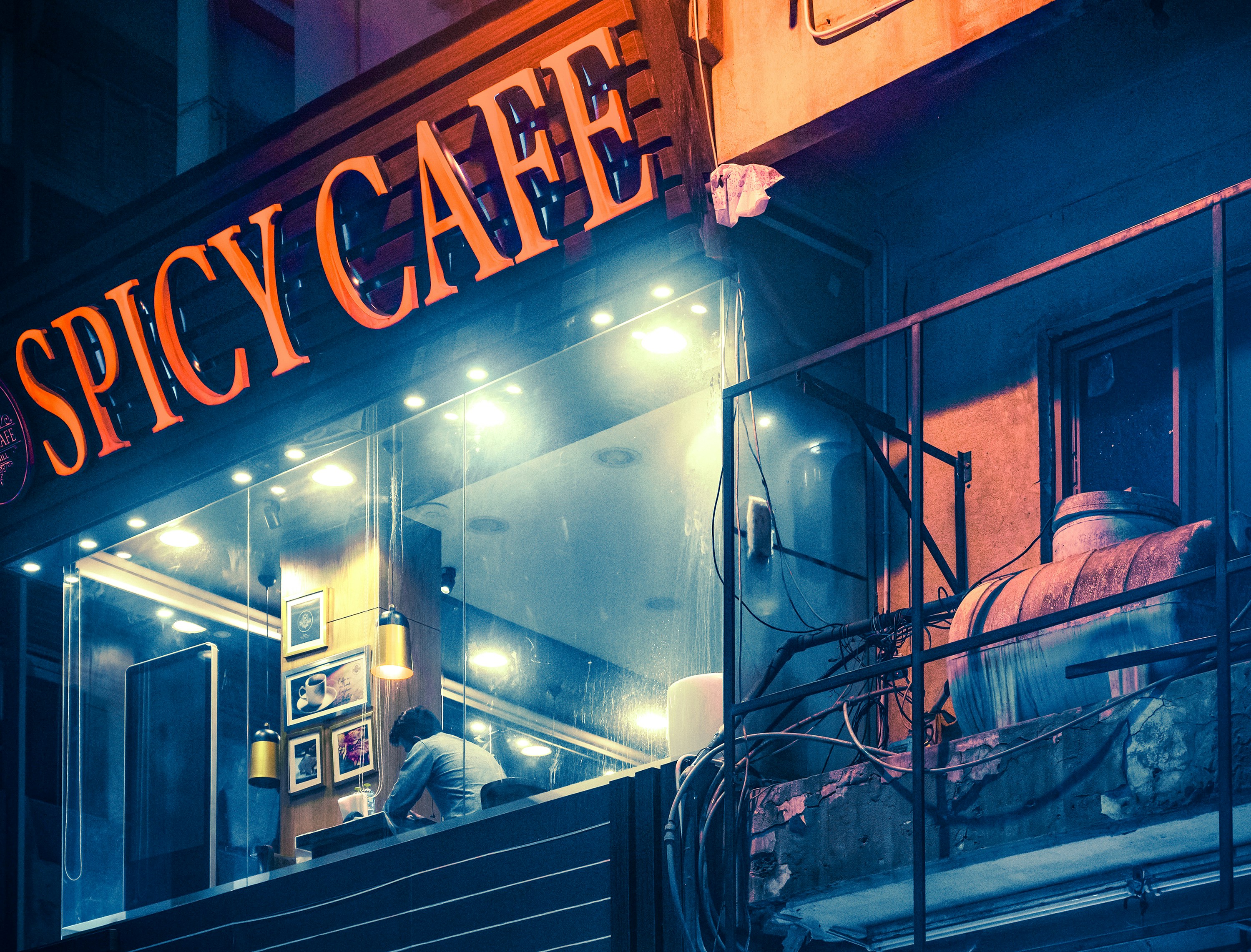 a restaurant with a sign that says spicy cafe