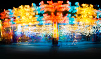 A vibrant swirl of colorful lights resembling a cosmic nebula, symbolizing the energy of human joy.