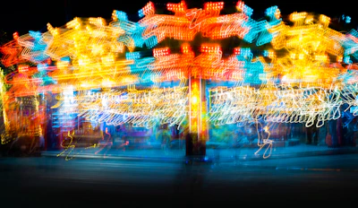 A vibrant swirl of colorful lights resembling a cosmic nebula, symbolizing the energy of human joy.