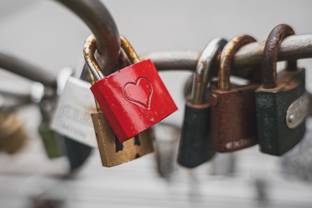 a red padlock with a heart on it