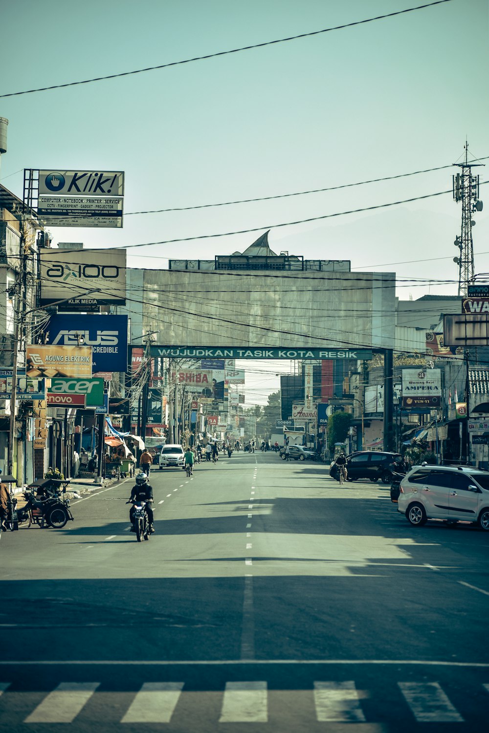 a person riding a motorcycle on a city street