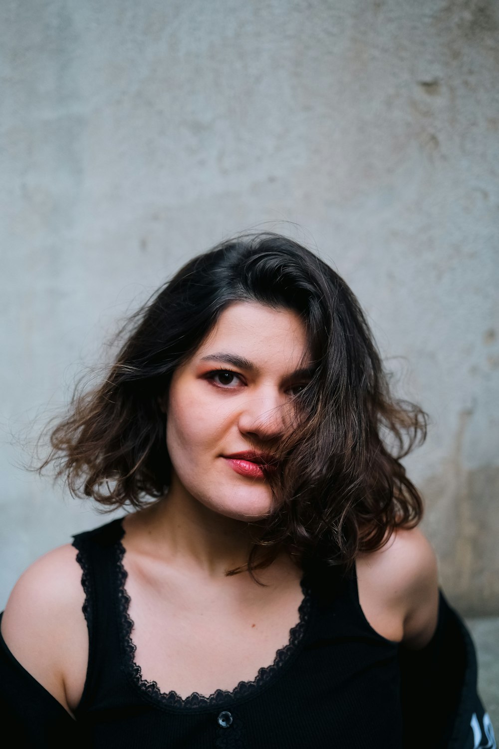 a woman in a black shirt posing for a picture