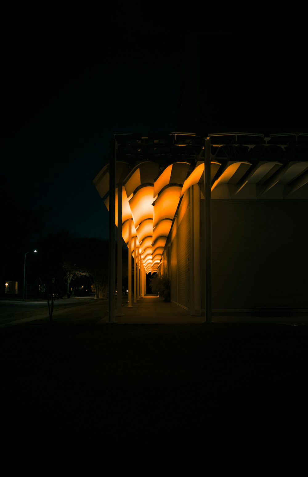 a person walking down a dark street at night