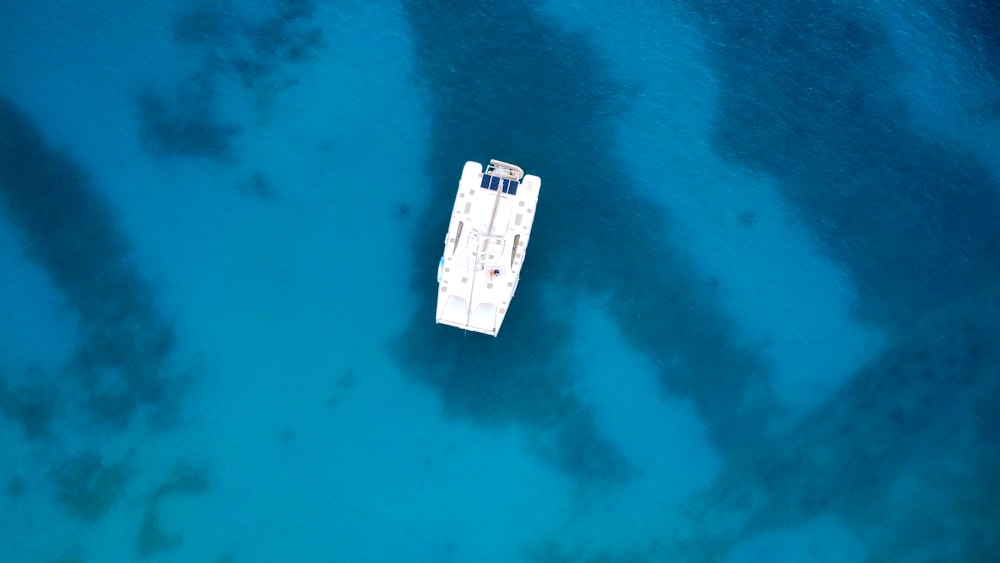 an aerial view of a boat in the water