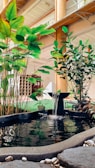 A custom-designed indoor fountain with artistic stonework and clear flowing water.