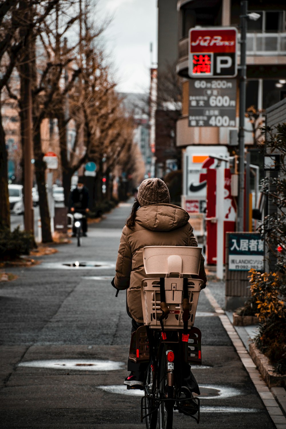 a person riding a bike down a street