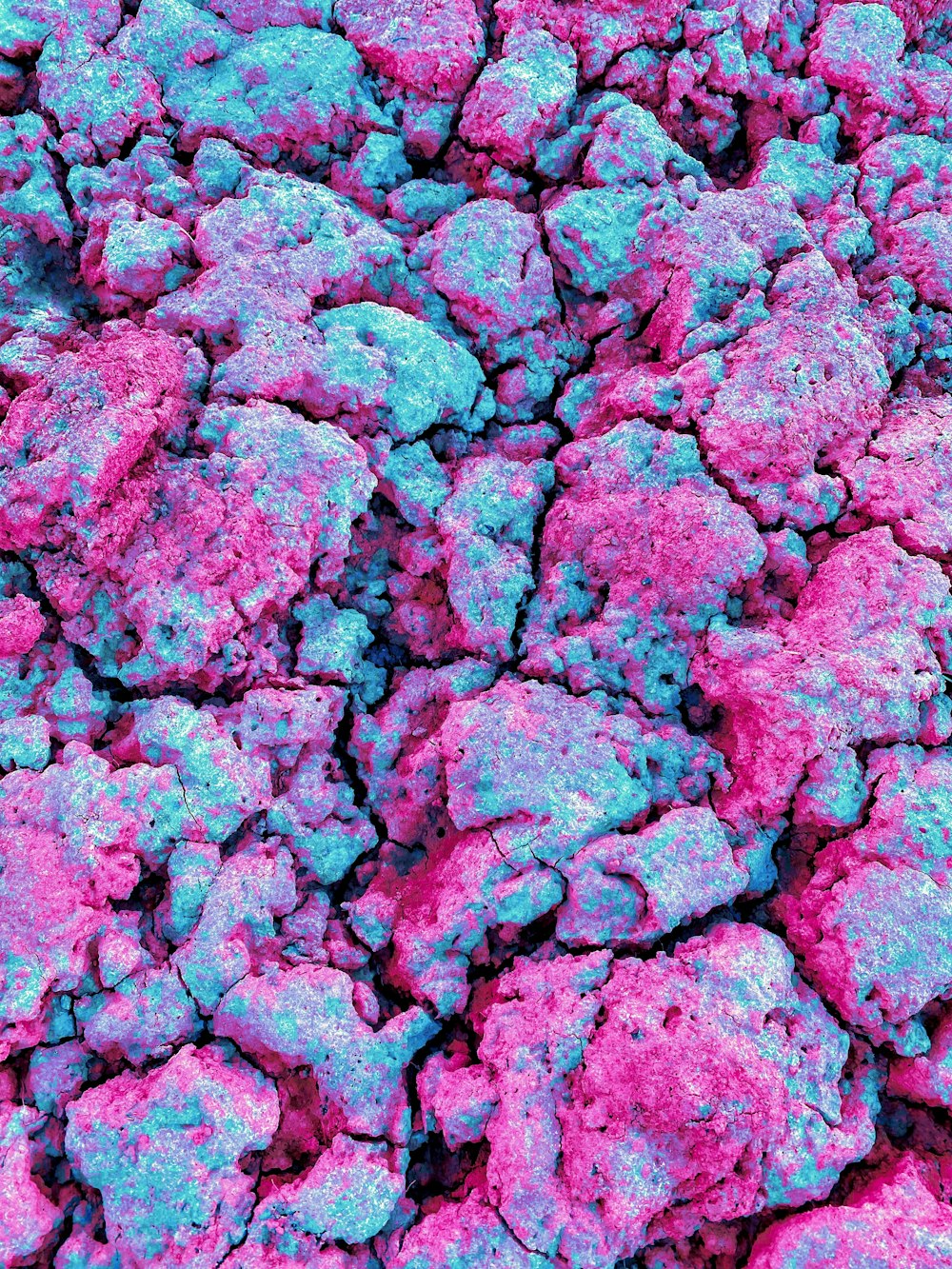 a bunch of rocks that are pink and blue