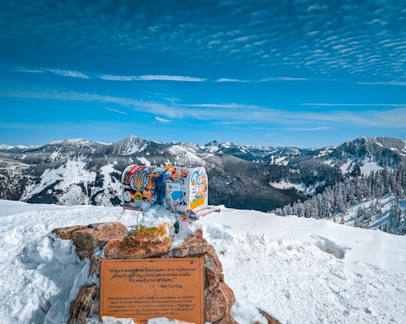 A delivery box placed at the foot of a scenic mountain view.