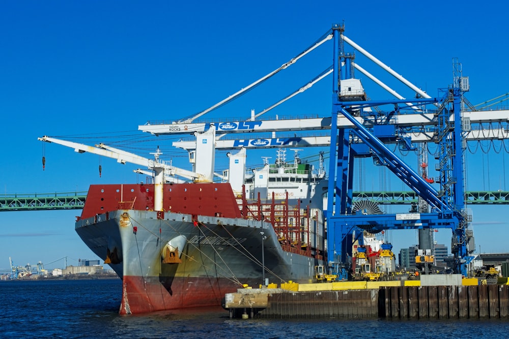 a large cargo ship docked at a dock