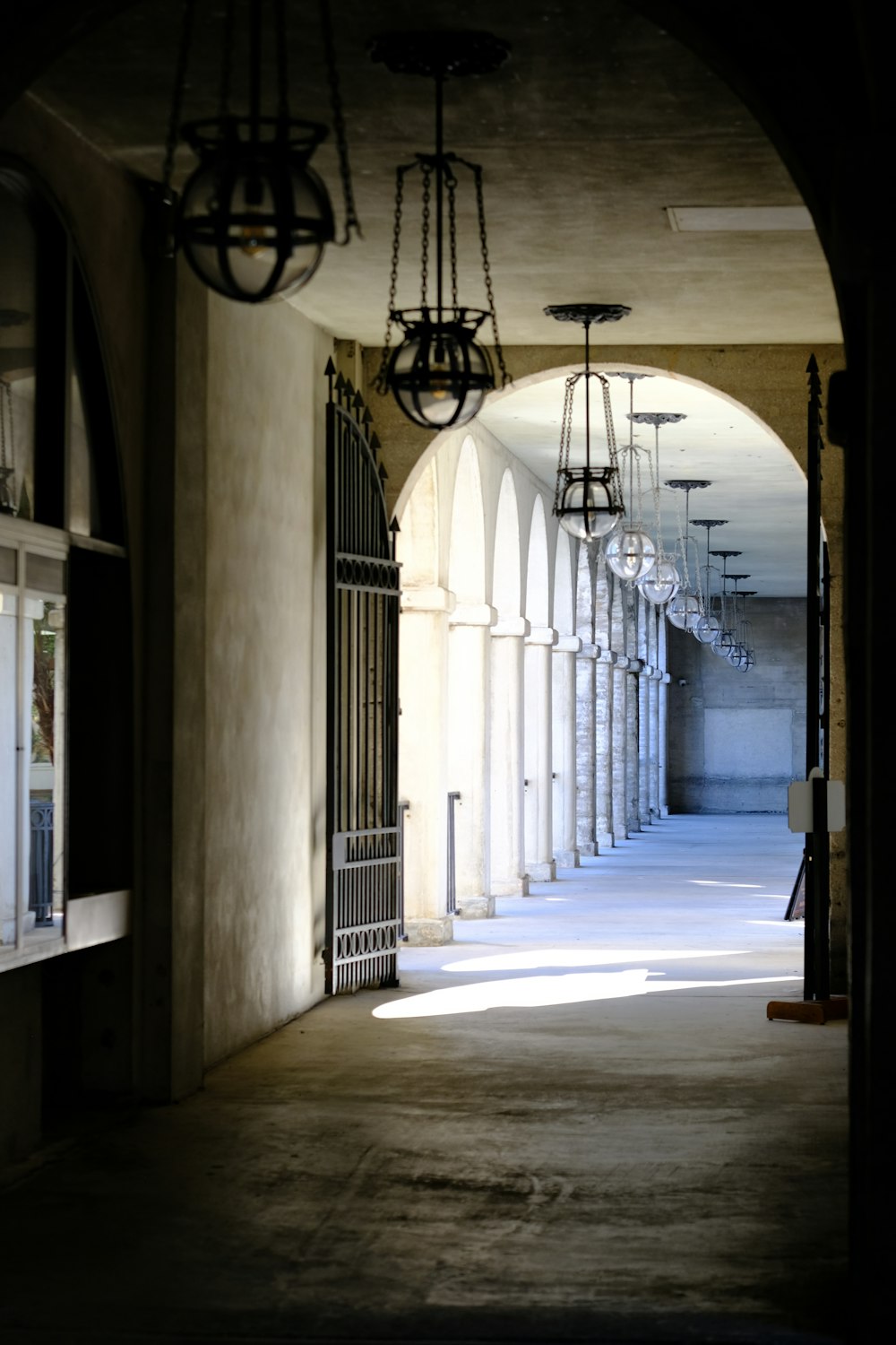 a hallway with a bunch of lights hanging from the ceiling