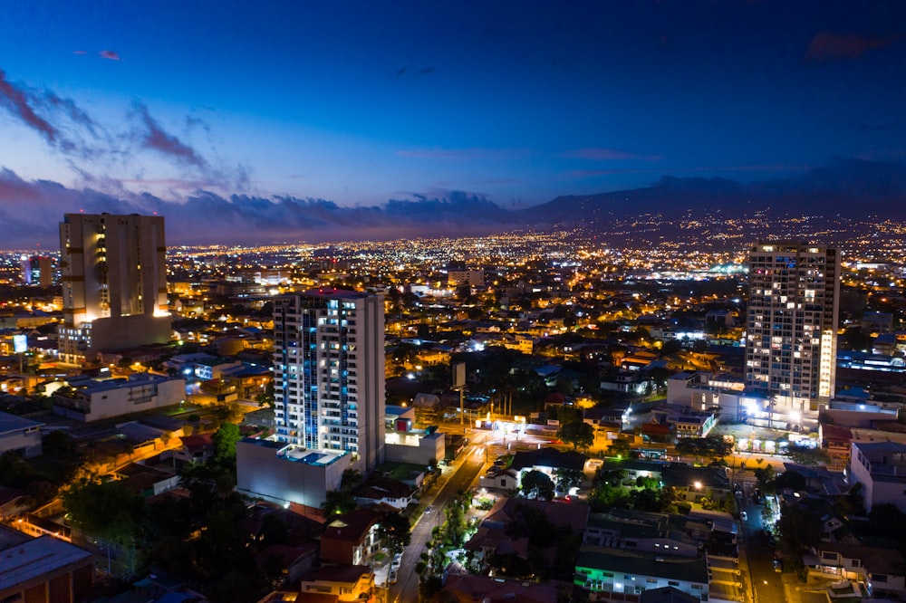 a view of a city at night from the top of a building