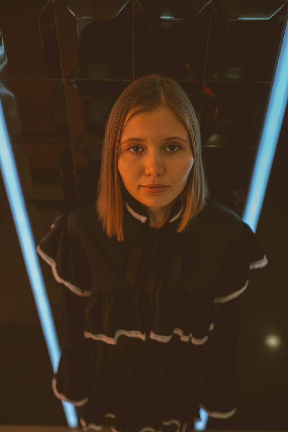 a woman standing in front of a star wars scene