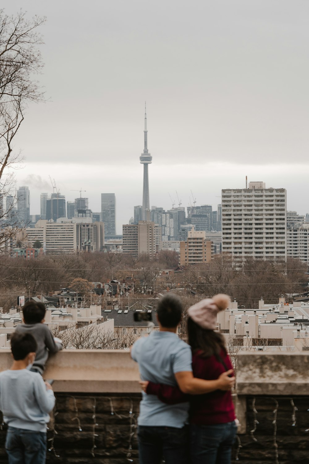 a couple of people standing on top of a roof