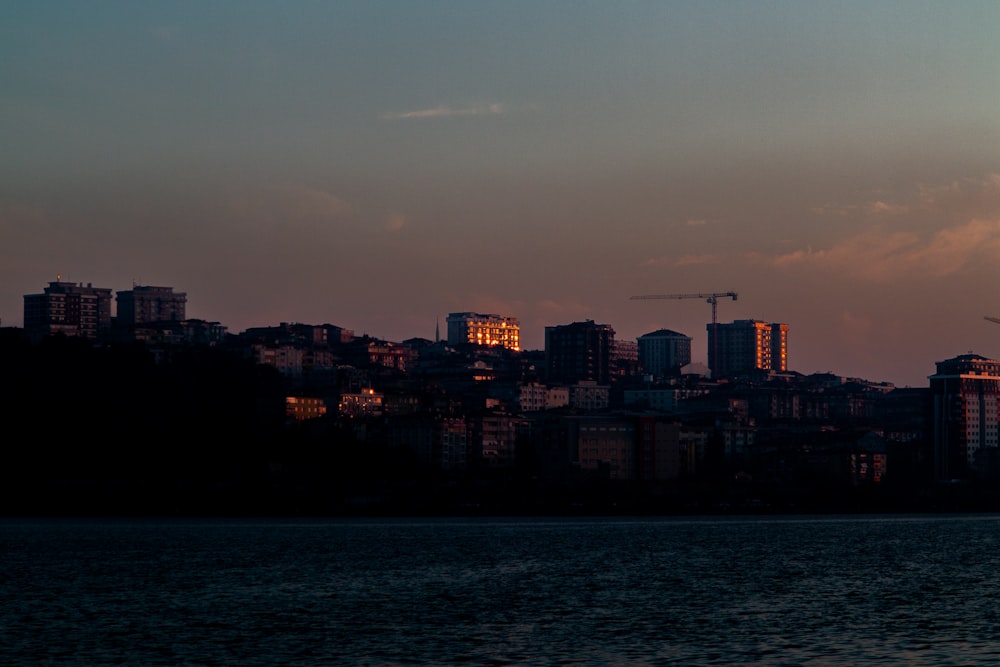 a large body of water with a city in the background