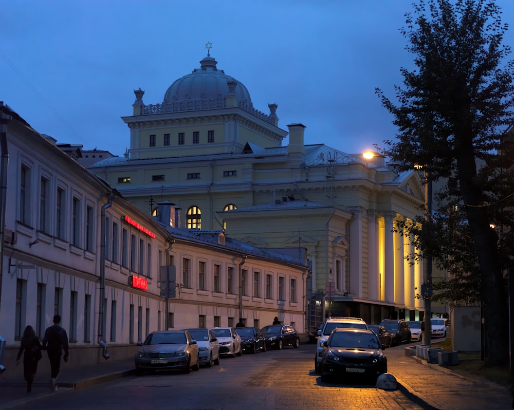 a city street with cars parked on the side of it