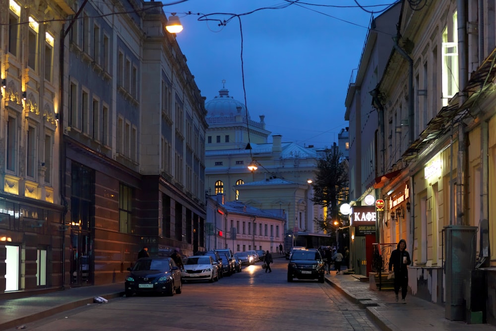 a city street with cars parked on the side of it