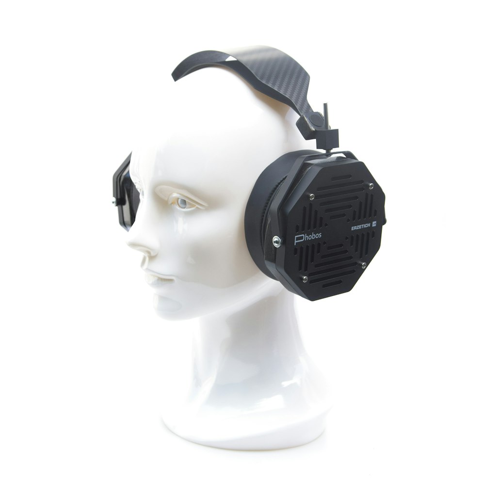 a white head with a pair of headphones on top of it