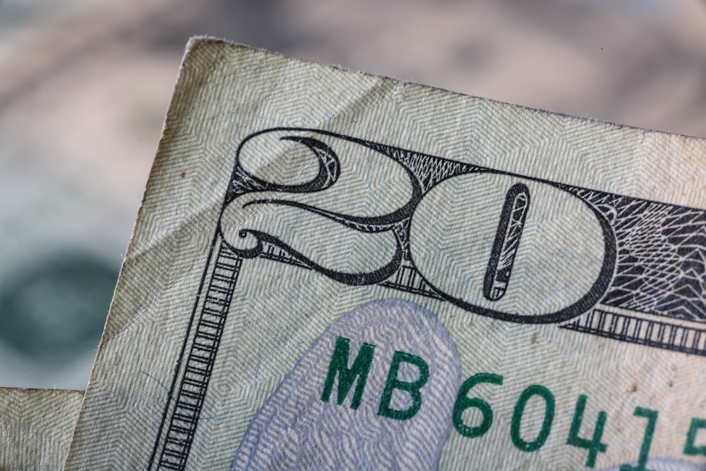 a close up of a twenty dollar bill
