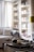 A cozy living room with ozaia candles illuminating the space.
