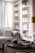 A cozy living room with ozaia candles illuminating the space.