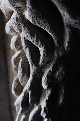Close-up of the textured surface of the sintered stone desk highlighting craftsmanship.