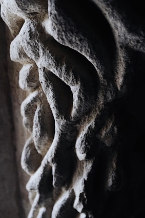 Close-up of a beautifully hand-carved stone sink with natural textures and smooth finish.