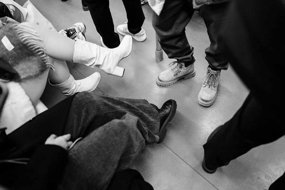 a group of people sitting on the floor in a circle