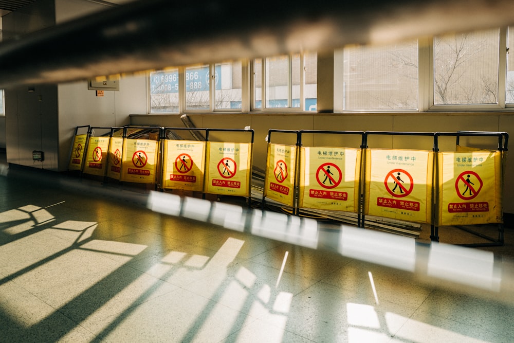 a row of yellow signs in a building