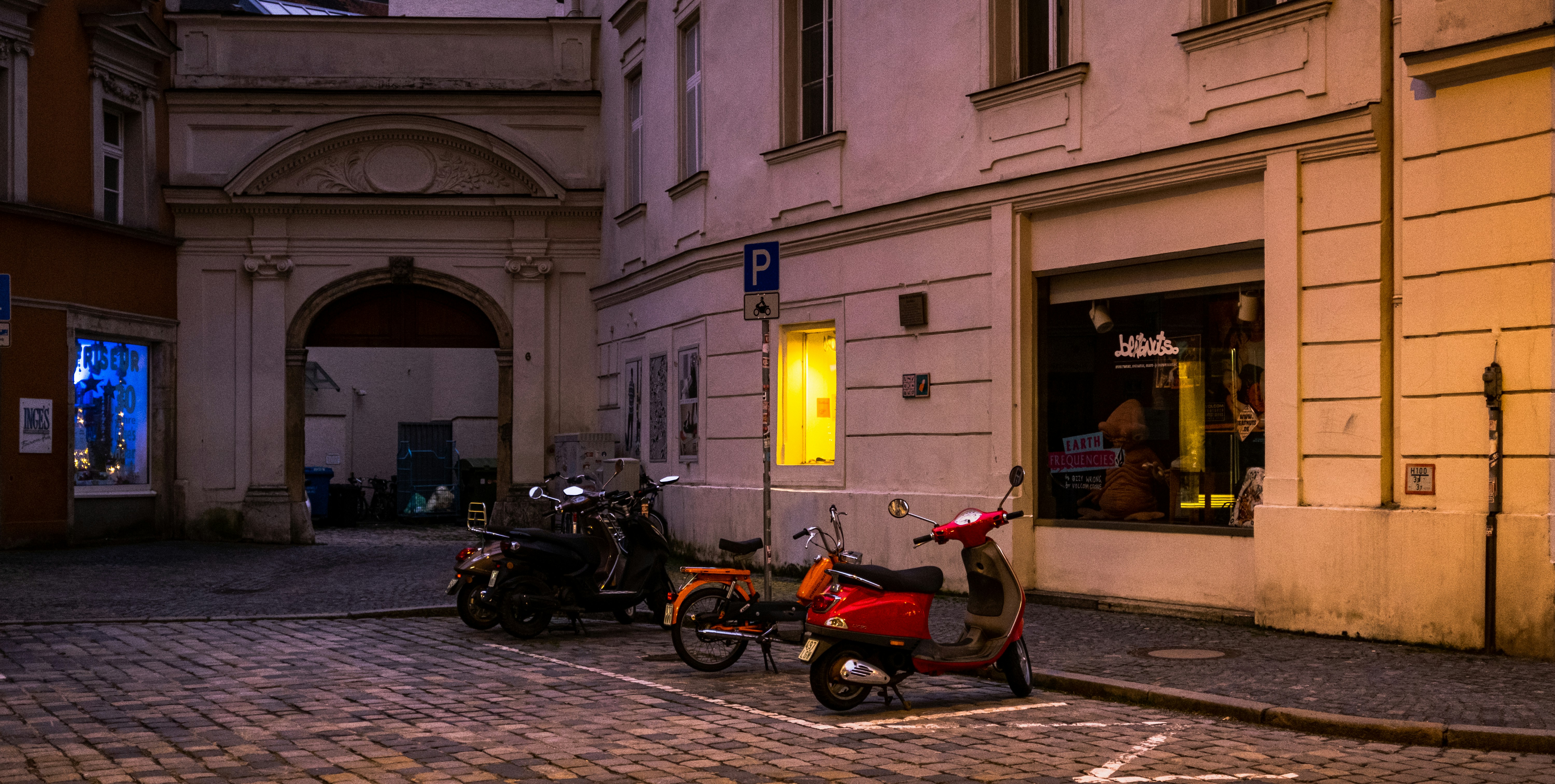 a couple of motorcycles parked next to each other on a street