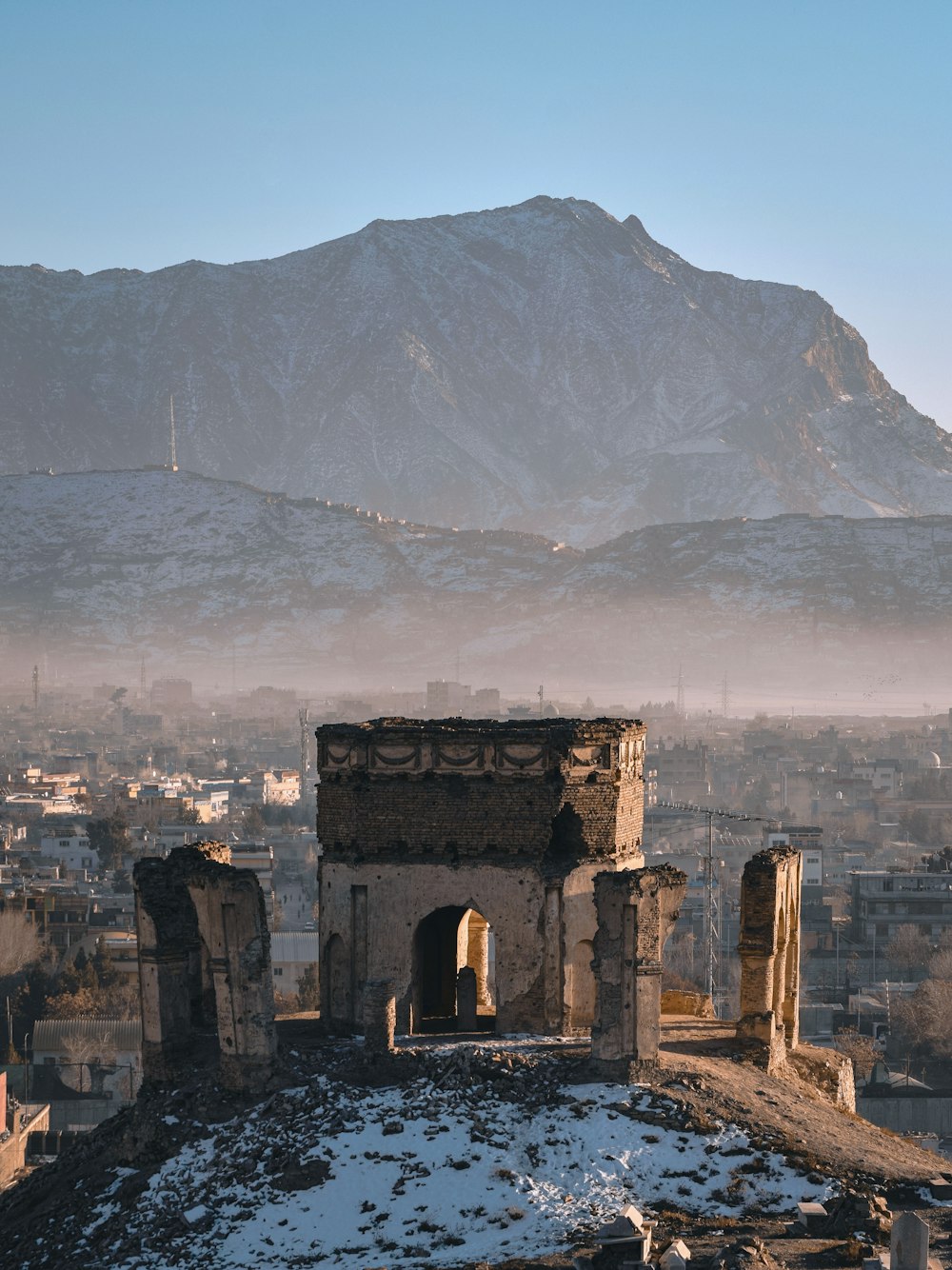 a view of a city with mountains in the background