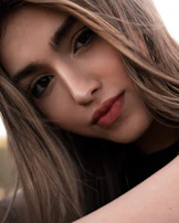 A before and after shot showing a natural makeup transformation on a young woman.