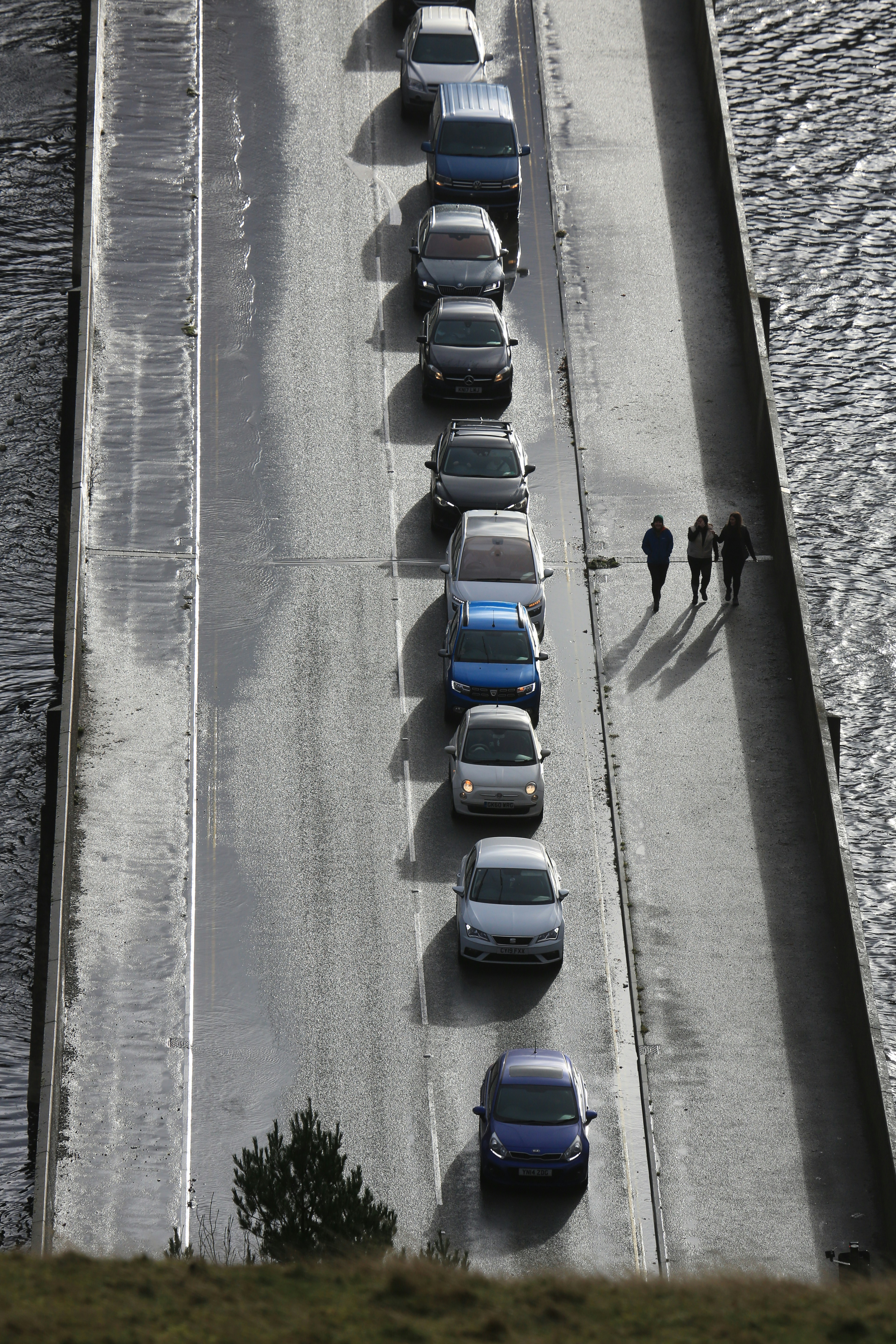 a group of cars parked on the side of a road
