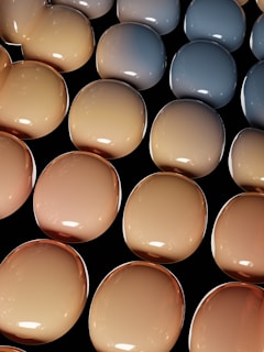 A cluster of sleek, glossy 3D elements arranged in a balanced composition with smooth gradients