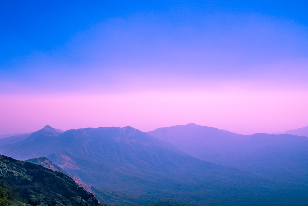 a view of a mountain range at dusk
