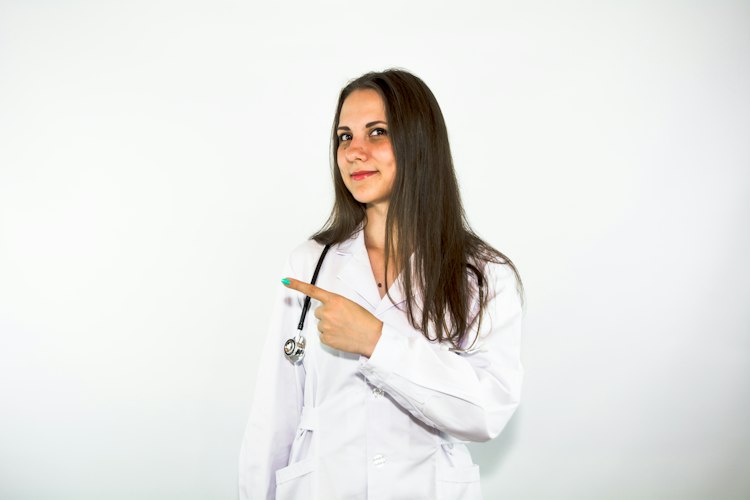 A doctor reviewing lab results on a tablet during a patient consultation