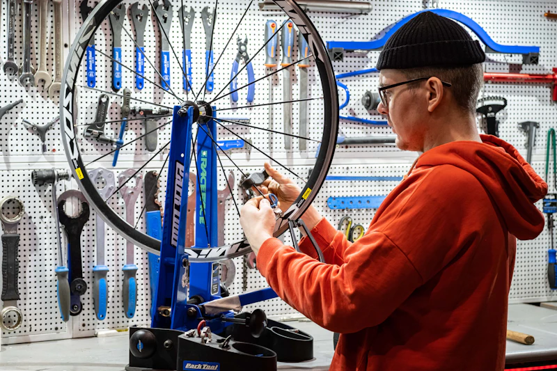 Mechanic working on a bicycle in a bike shop