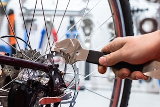 Mechanic performing brake repair on a vehicle with tools neatly arranged nearby
