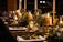 A beautifully set dining table with elegant tableware and soft candlelight.