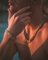 a man wearing a gold chain around his neck